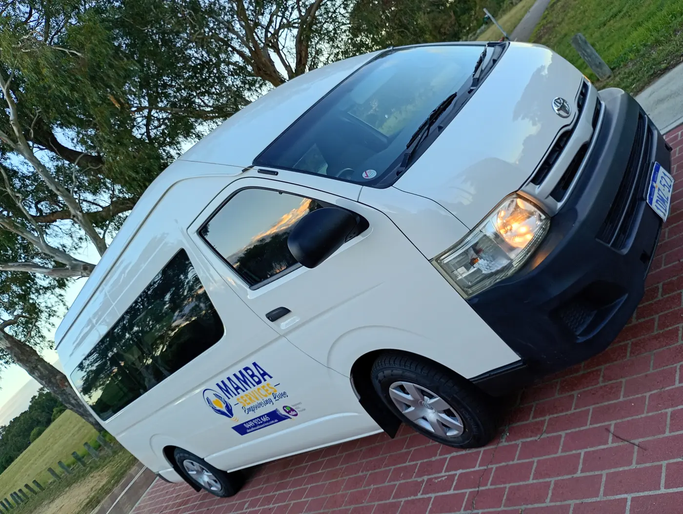 Mamba Services wheelchair accessible van parked, front side view